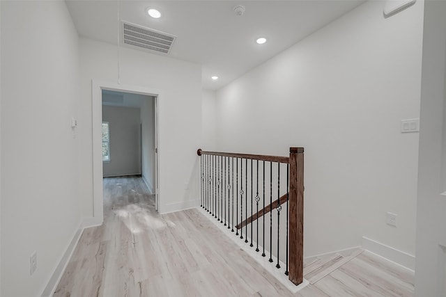 7002 Sidney St, Houston, TX 77021 - corridor featuring an upstairs landing, light wood-style flooring, recessed lighting, attic access, and baseboards