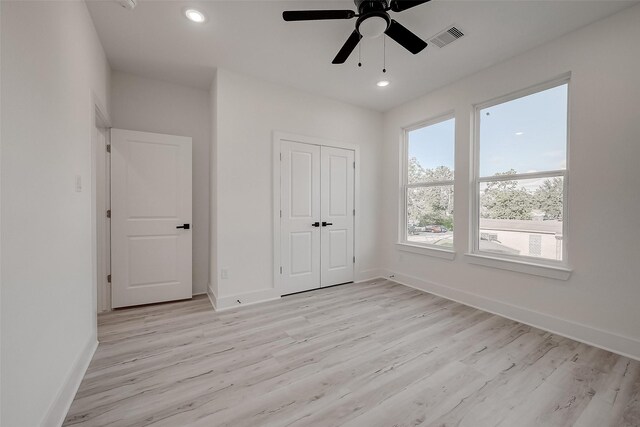 7002 Sidney St, Houston, TX 77021 - unfurnished bedroom featuring baseboards, light wood-style floors, recessed lighting, a closet, and ceiling fan