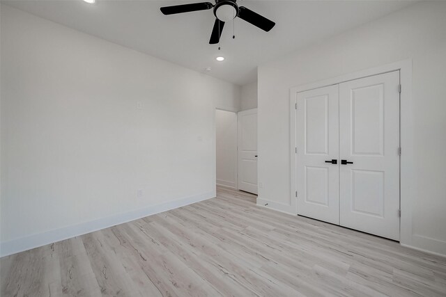 7002 Sidney St, Houston, TX 77021 - unfurnished bedroom with light wood-style floors, a closet, recessed lighting, and baseboards