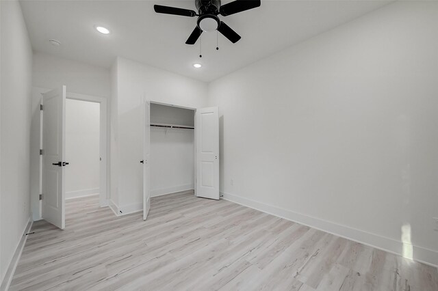 7002 Sidney St, Houston, TX 77021 - unfurnished bedroom with light wood-style flooring, baseboards, recessed lighting, a closet, and ceiling fan