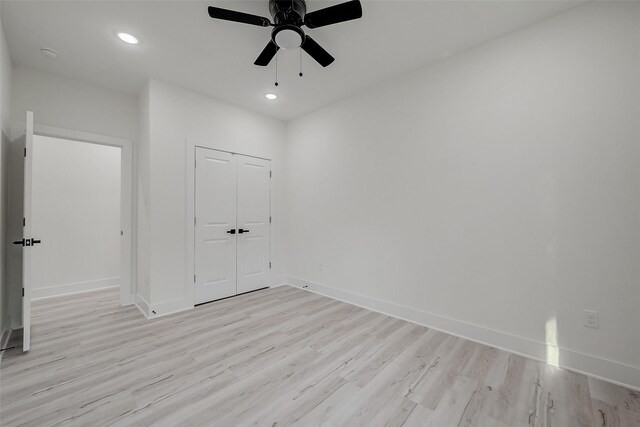 7002 Sidney St, Houston, TX 77021 - unfurnished bedroom featuring light wood-style flooring, baseboards, recessed lighting, a closet, and a ceiling fan