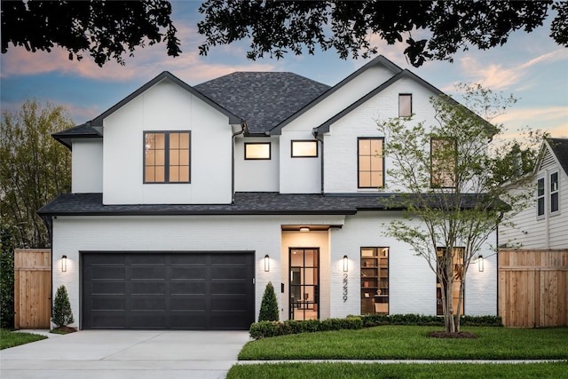 2239 Colquitt St, Houston, TX 77098 - view of front of home featuring an attached garage, concrete driveway, and a shingled roof