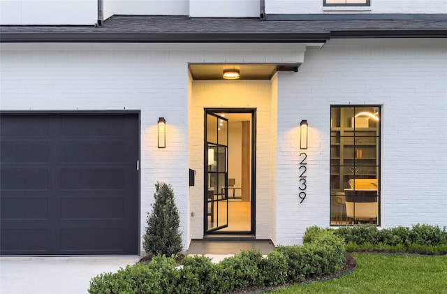 2239 Colquitt St, Houston, TX 77098 - doorway to property featuring brick siding and a garage