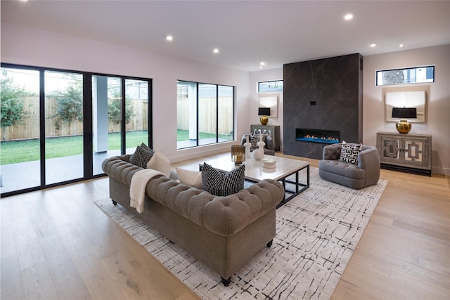 2239 Colquitt St, Houston, TX 77098 - living room with recessed lighting, light wood-style flooring, and a premium fireplace