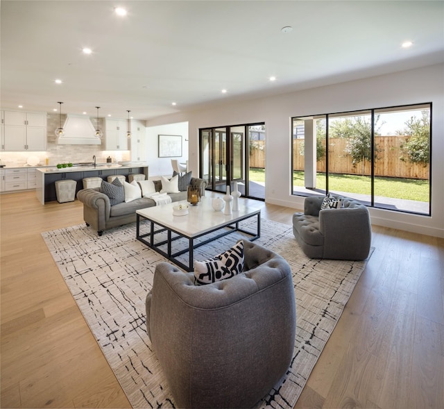 2239 Colquitt St, Houston, TX 77098 - living room featuring recessed lighting and light wood-style floors