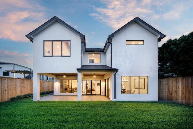 2239 Colquitt St, Houston, TX 77098 - rear view of house with a patio area, a fenced backyard, ceiling fan, and stucco siding