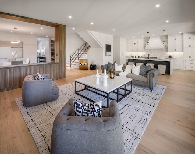 2239 Colquitt St, Houston, TX 77098 - living area featuring stairs, light wood-style floors, and recessed lighting