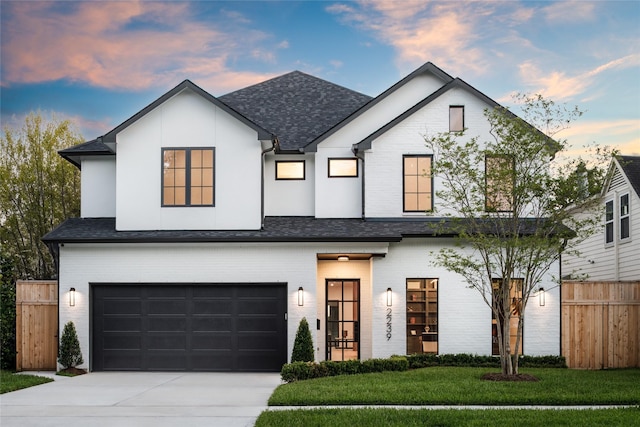 2239 Colquitt St, Houston, TX 77098 - view of front of house featuring a garage, driveway, a shingled roof, and brick siding