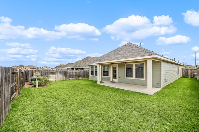 723 Larkspur Shadow Dr, Magnolia, TX 77354 - back of house featuring a shingled roof and a patio area
