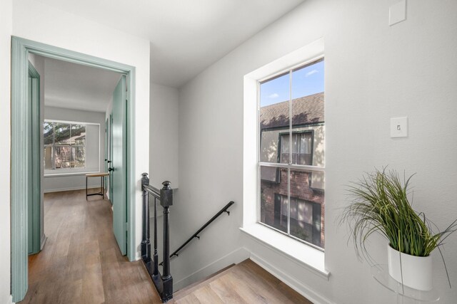 14703 Barryknoll Ln Unit 26, Houston, TX 77079 - hallway with an upstairs landing and wood finished floors