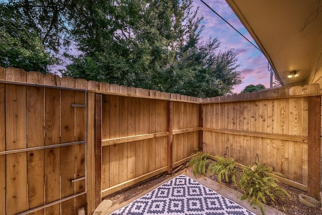 14703 Barryknoll Ln Unit 26, Houston, TX 77079 - view of patio terrace at dusk