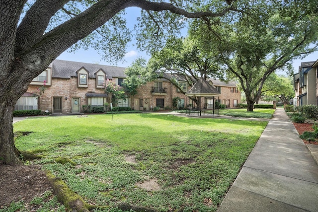 14703 Barryknoll Ln Unit 26, Houston, TX 77079 - view of property's community with a yard