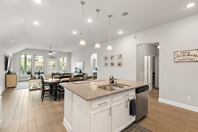 18226 Sofia Willow Way, Cypress, TX 77429 - kitchen featuring stainless steel dishwasher, a center island with sink, light wood-style floors, open floor plan, and ceiling fan