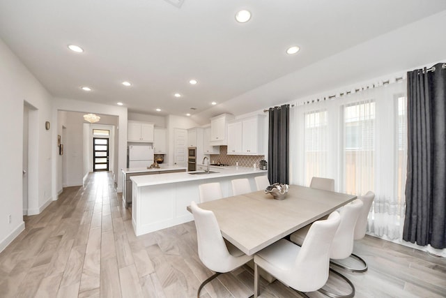 11414 Bush Clover Dr, Cypress, TX 77433 - dining area with recessed lighting, baseboards, and light wood-style floors