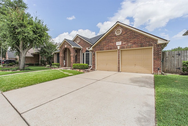 2001 Navajo Dr, Deer Park, TX 77536 - view of front of house with brick siding, a garage, and concrete driveway