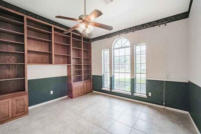 2001 Navajo Dr, Deer Park, TX 77536 - empty room with wallpapered walls, a ceiling fan, light tile patterned flooring, and built in features