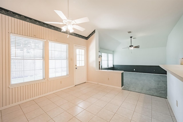 2001 Navajo Dr, Deer Park, TX 77536 - kitchen featuring a ceiling fan, lofted ceiling, light tile patterned flooring, and light colored carpet