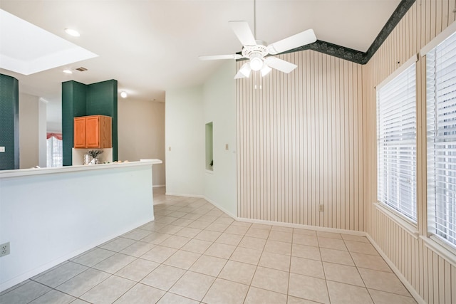 2001 Navajo Dr, Deer Park, TX 77536 - unfurnished room featuring healthy amount of natural light, light tile patterned floors, and a ceiling fan