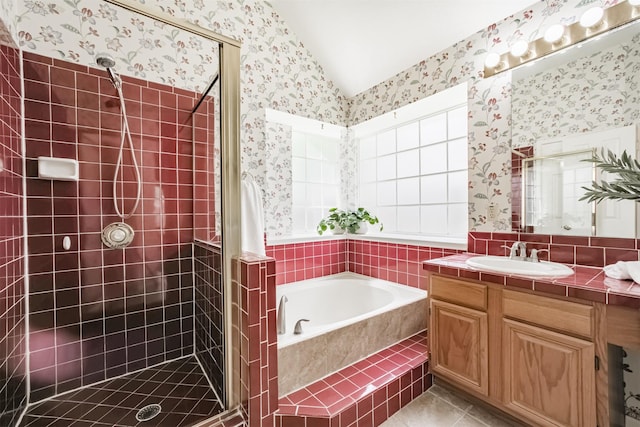 2001 Navajo Dr, Deer Park, TX 77536 - full bath with wallpapered walls, vaulted ceiling, a shower stall, a bath, and vanity