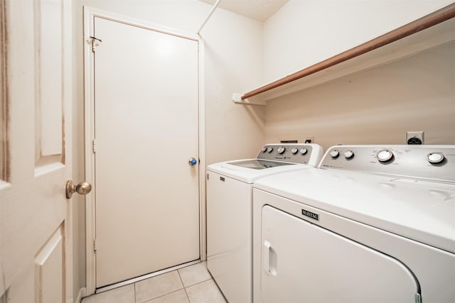 2001 Navajo Dr, Deer Park, TX 77536 - washroom featuring washer and dryer and light tile patterned floors