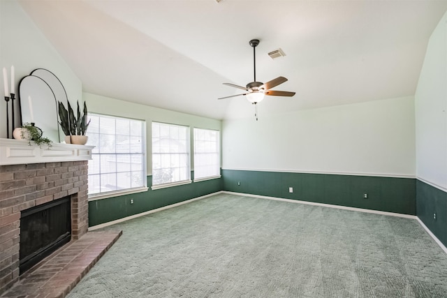 2001 Navajo Dr, Deer Park, TX 77536 - unfurnished living room featuring carpet flooring, a ceiling fan, and a brick fireplace