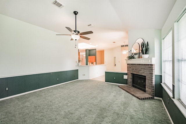 2001 Navajo Dr, Deer Park, TX 77536 - unfurnished living room featuring carpet, a fireplace, and a ceiling fan