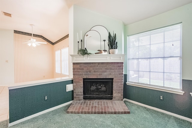 2001 Navajo Dr, Deer Park, TX 77536 - unfurnished living room featuring lofted ceiling, a fireplace, plenty of natural light, a ceiling fan, and carpet flooring