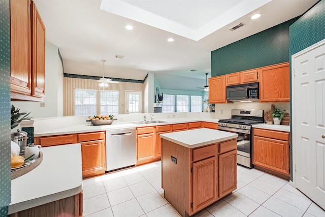 2001 Navajo Dr, Deer Park, TX 77536 - kitchen featuring stainless steel appliances, a ceiling fan, a peninsula, light countertops, and recessed lighting