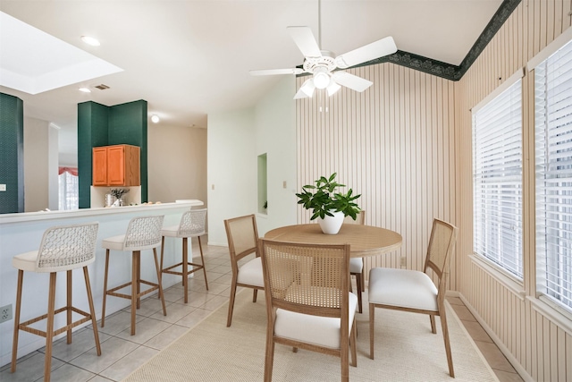 2001 Navajo Dr, Deer Park, TX 77536 - dining space featuring light tile patterned flooring, ceiling fan, and wallpapered walls