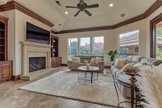 9814 Cape Breeze Dr, Houston, TX 77070 - living room with plenty of natural light, a ceiling fan, a fireplace with raised hearth, built in features, and recessed lighting