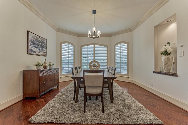 9814 Cape Breeze Dr, Houston, TX 77070 - dining room with a chandelier, crown molding, dark wood-style floors, and baseboards