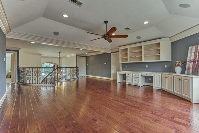 9814 Cape Breeze Dr, Houston, TX 77070 - unfurnished living room with a tray ceiling, crown molding, wood finished floors, ceiling fan, and recessed lighting
