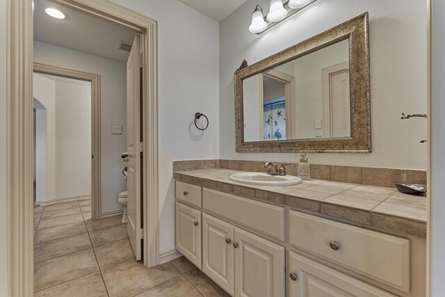 9814 Cape Breeze Dr, Houston, TX 77070 - bathroom with toilet, vanity, and tile patterned flooring
