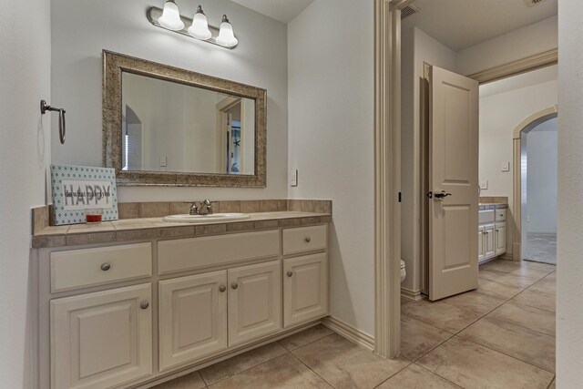 9814 Cape Breeze Dr, Houston, TX 77070 - bathroom with vanity, tile patterned floors, and toilet