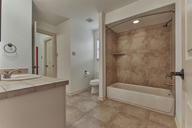 9814 Cape Breeze Dr, Houston, TX 77070 - full bathroom with toilet, vanity, bathing tub / shower combination, tile patterned floors, and baseboards