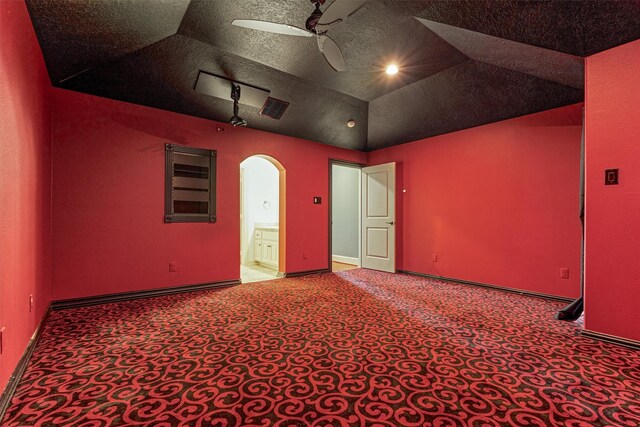9814 Cape Breeze Dr, Houston, TX 77070 - empty room featuring a ceiling fan, arched walkways, carpet flooring, baseboards, and vaulted ceiling