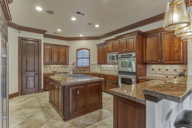 9814 Cape Breeze Dr, Houston, TX 77070 - kitchen featuring appliances with stainless steel finishes, crown molding, backsplash, a kitchen island, and a peninsula