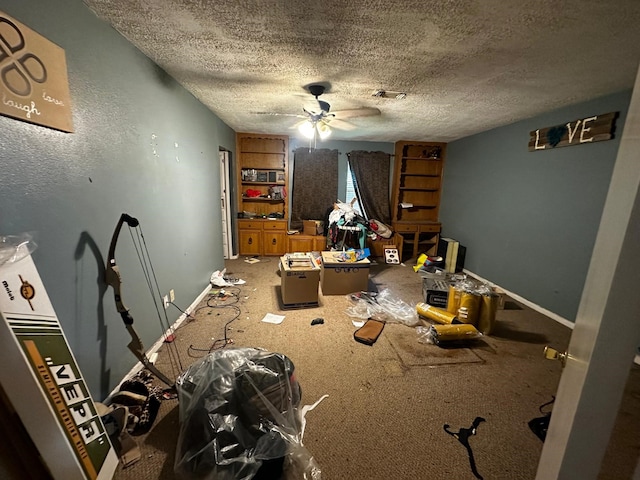 1225 County Road 878b, Sweeny, TX 77480 - bedroom featuring a textured ceiling, baseboards, carpet flooring, and ceiling fan