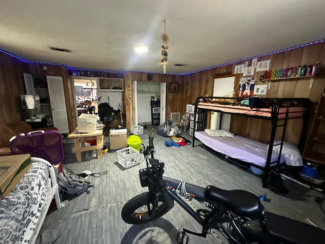 1225 County Road 878b, Sweeny, TX 77480 - bedroom with wood finished floors and wooden walls