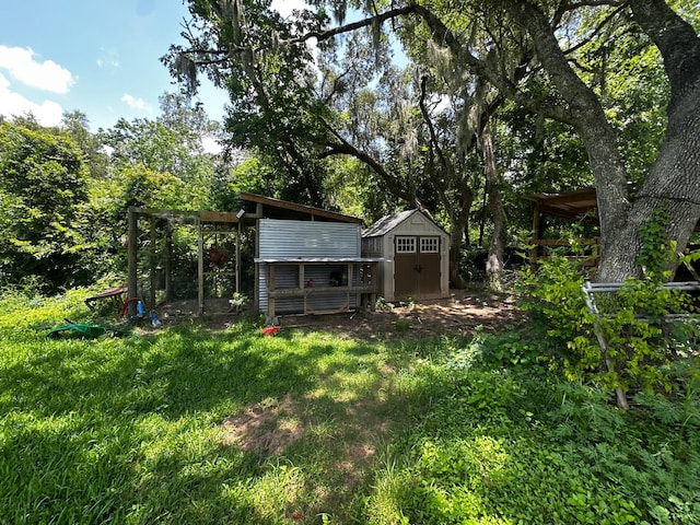 1225 County Road 878b, Sweeny, TX 77480 - view of yard featuring exterior structure