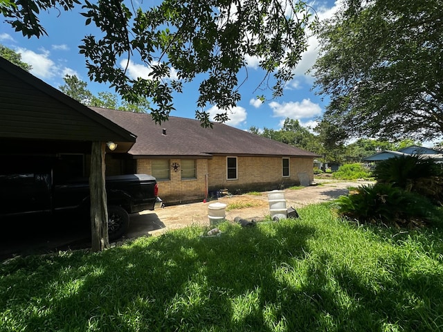 1225 County Road 878b, Sweeny, TX 77480 - rear view of house with brick siding and a shingled roof