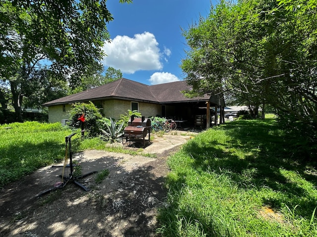 1225 County Road 878b, Sweeny, TX 77480 - rear view of house featuring brick siding