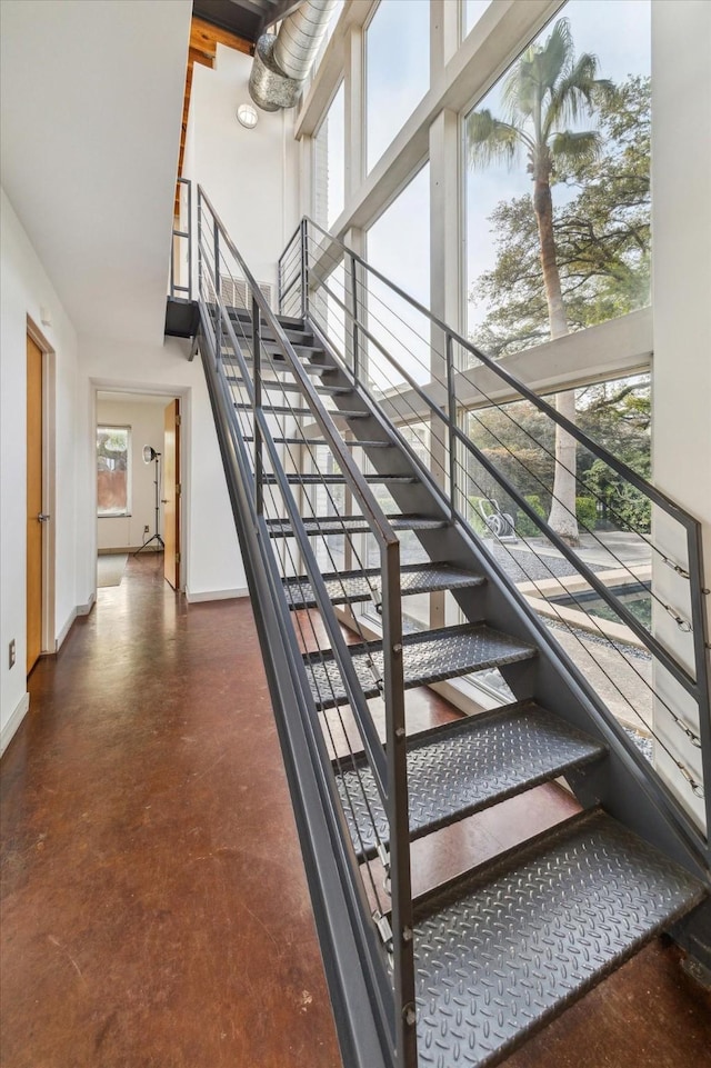 2327 Peckham St, Houston, TX 77019 - stairs with a high ceiling and concrete flooring