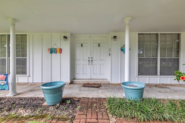 410 Azalea Dr, Baytown, TX 77520 - entrance to property featuring board and batten siding and a porch
