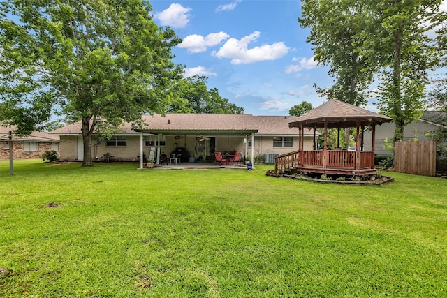 410 Azalea Dr, Baytown, TX 77520 - rear view of property with a gazebo, a patio area, ceiling fan, and brick siding