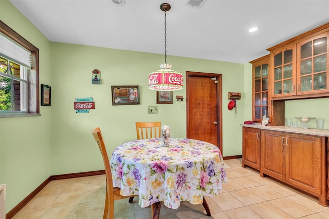 410 Azalea Dr, Baytown, TX 77520 - dining area with light tile patterned floors and recessed lighting