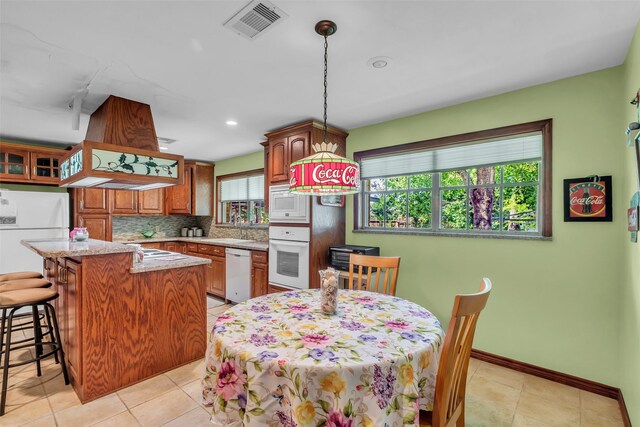 410 Azalea Dr, Baytown, TX 77520 - dining area with light tile patterned floors and recessed lighting