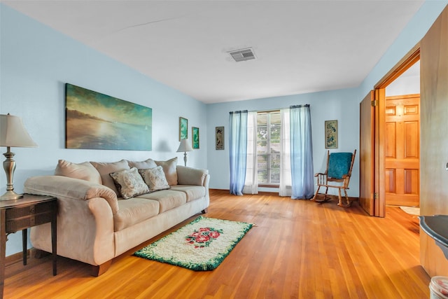 410 Azalea Dr, Baytown, TX 77520 - living area featuring light wood-type flooring and baseboards