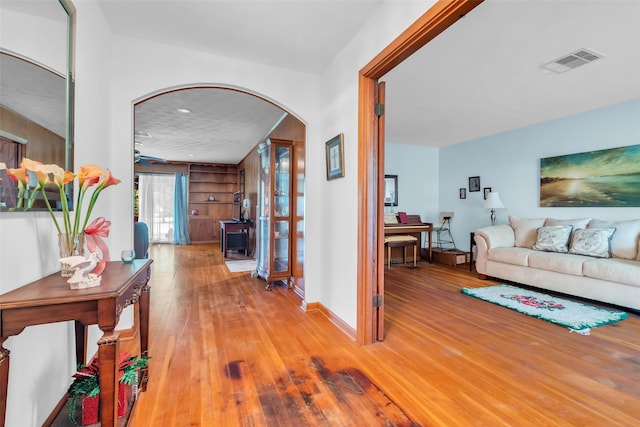 410 Azalea Dr, Baytown, TX 77520 - corridor with arched walkways and hardwood / wood-style flooring