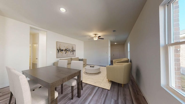18777 Lucas Michael Way, New Caney, TX 77357 - dining area with wood finished floors, ceiling fan, and plenty of natural light